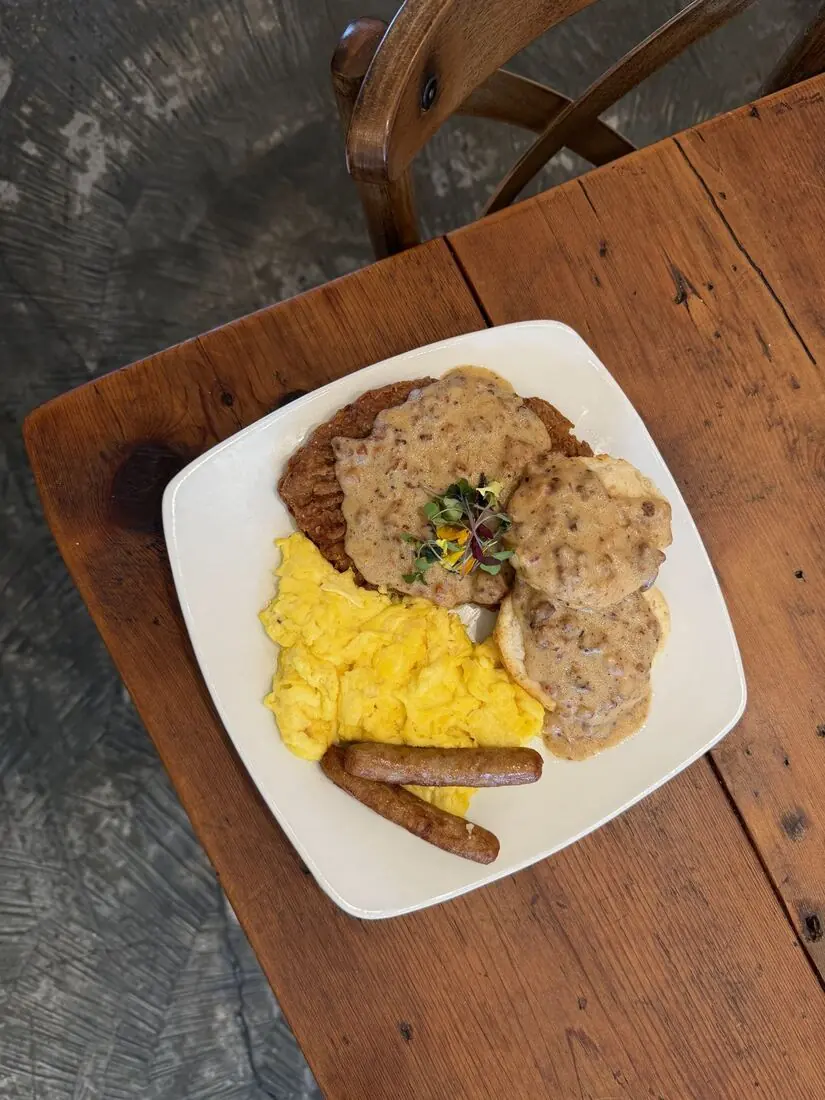 Country fried steak with gravy, scrambled eggs and sausage
