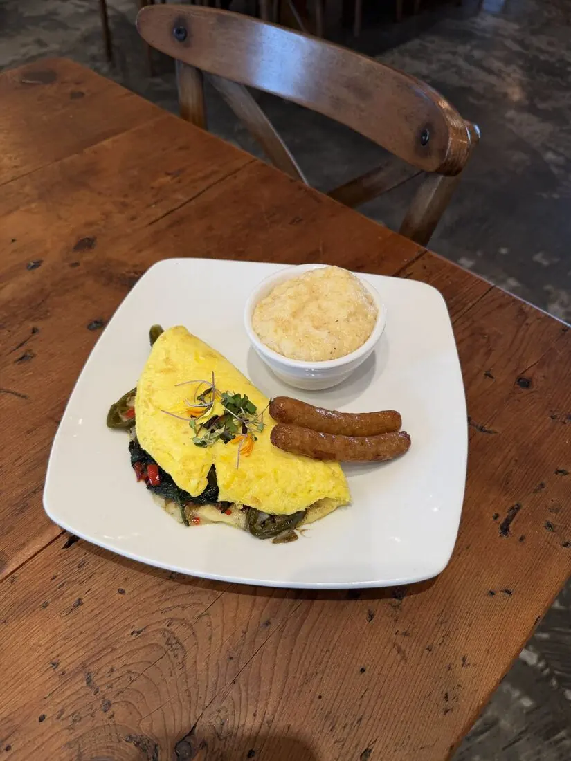 Omelette with sausage links and grits