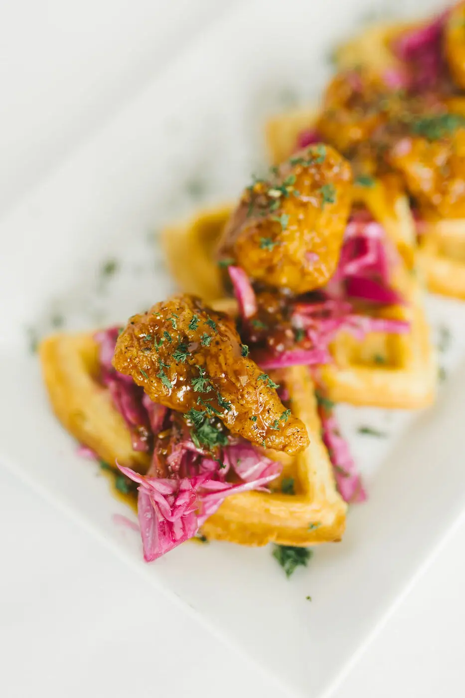 Chicken and waffles with Korean barbecue sauce and Asian slaw