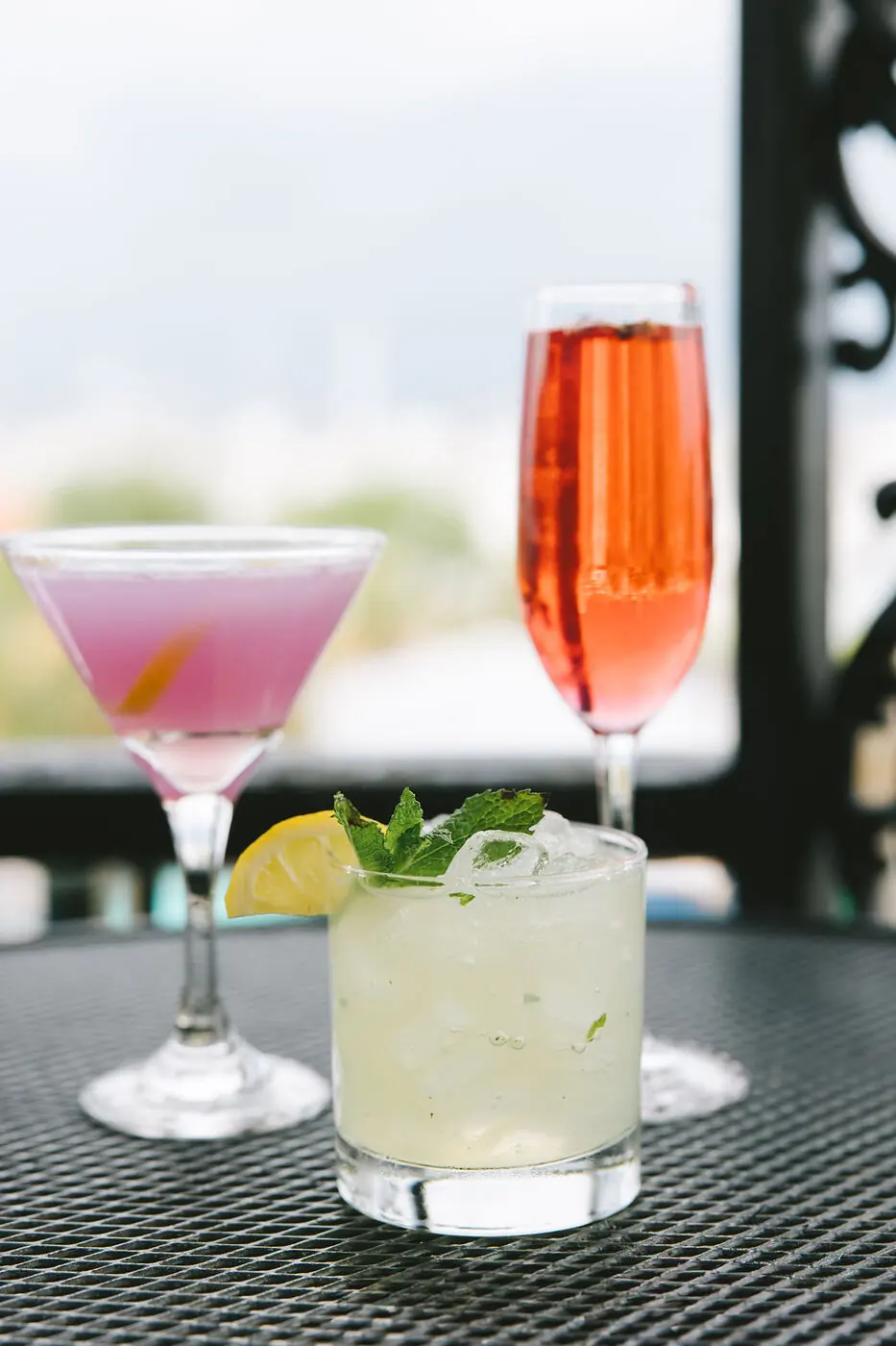 Three cocktails on the balcony